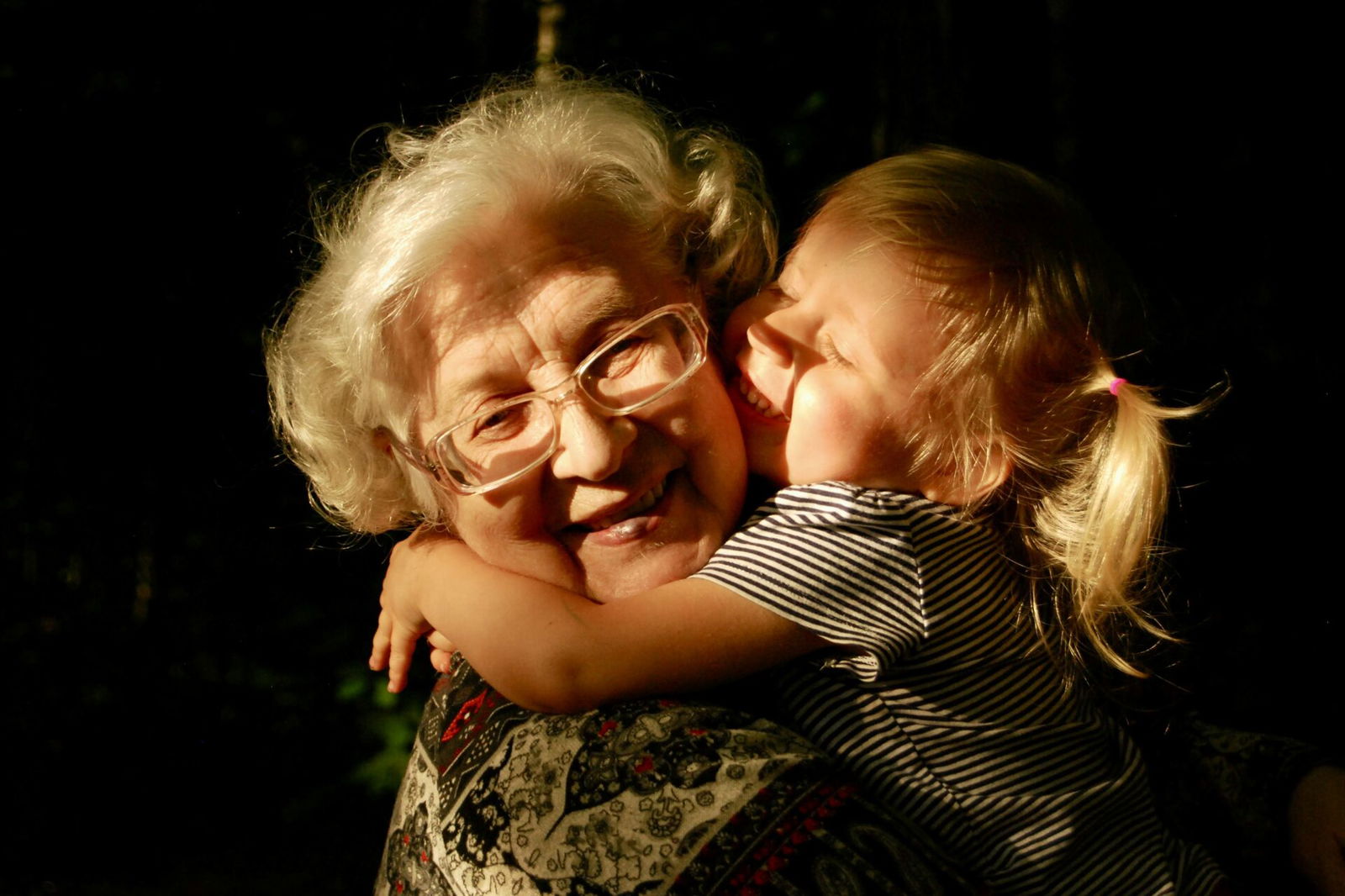 Grandma hugging granddaughter