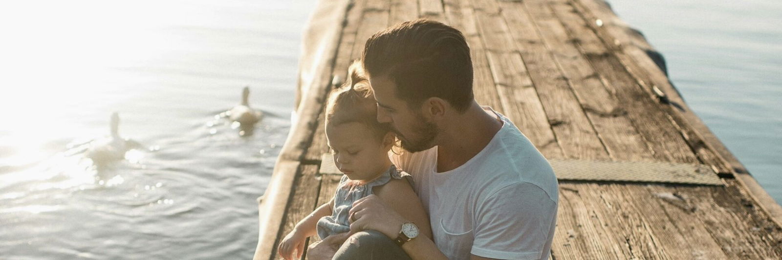Dad with child on a dock