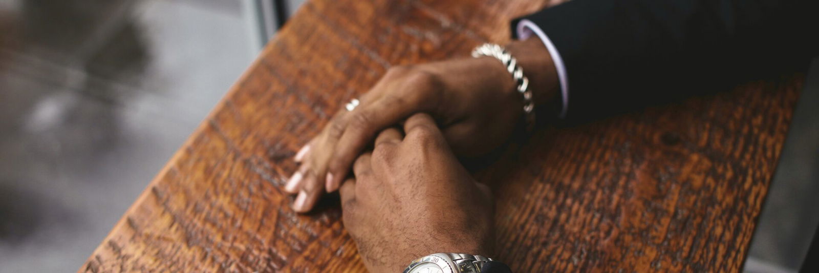 Persons hands on a table