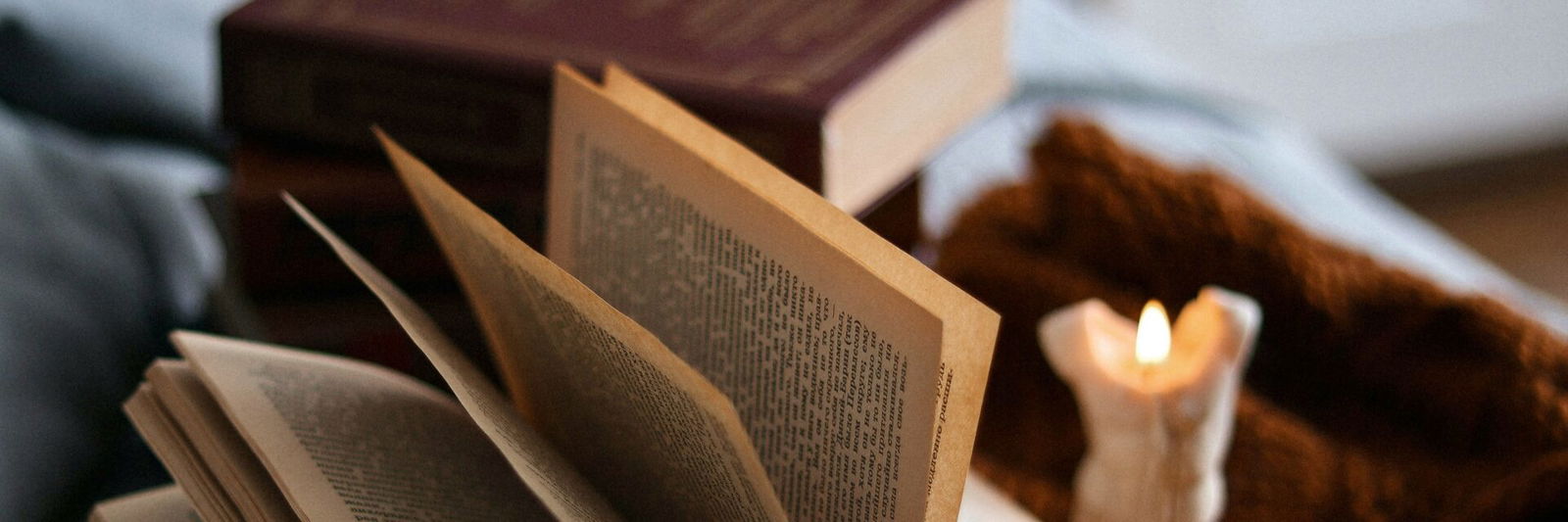 Book with lit candle