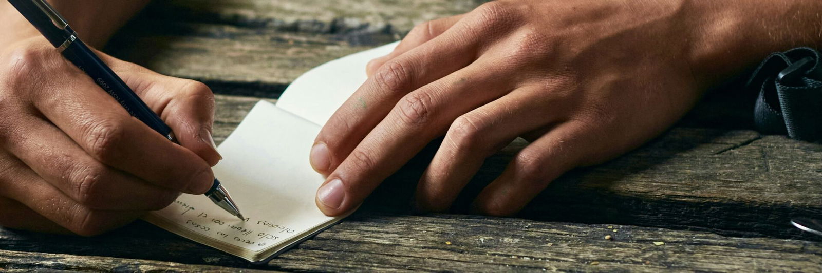 Hands writing note