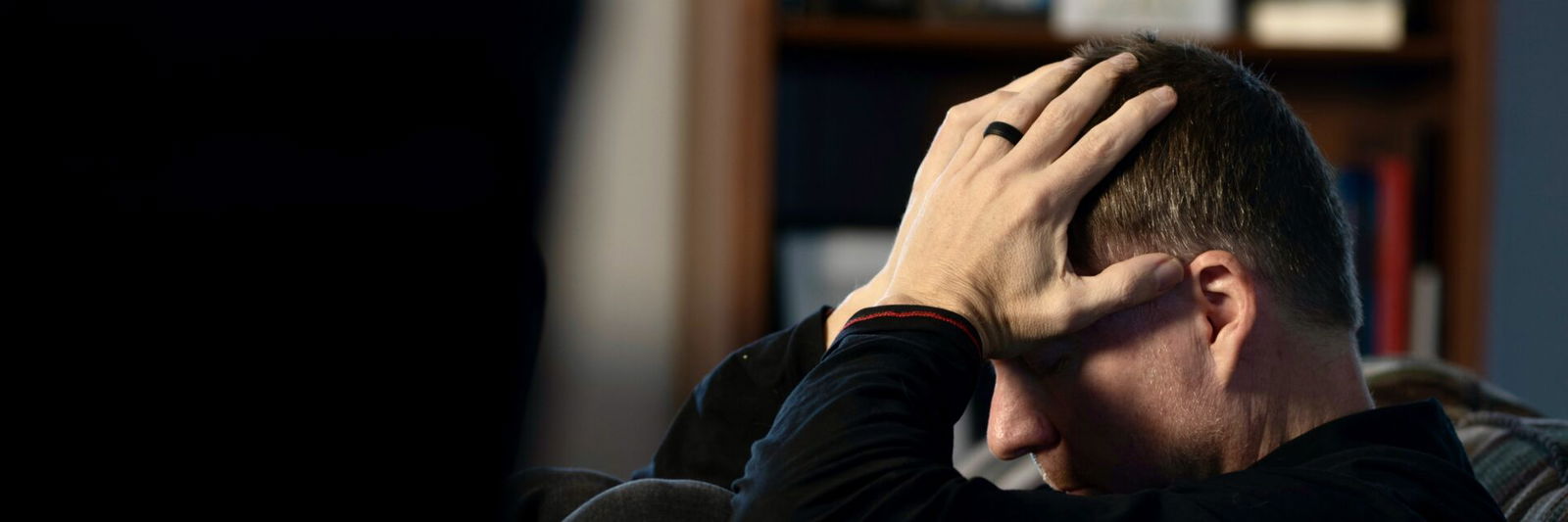 Person with head in hands