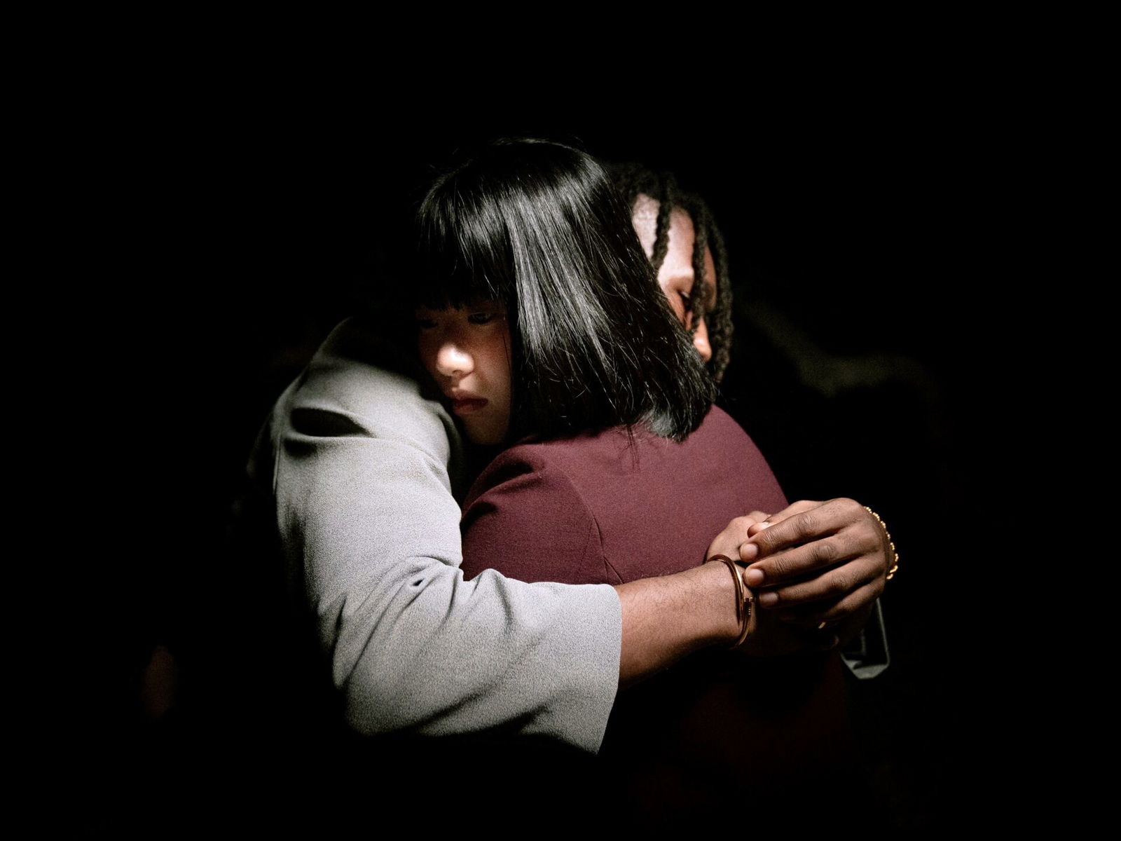 Two people offering comfort