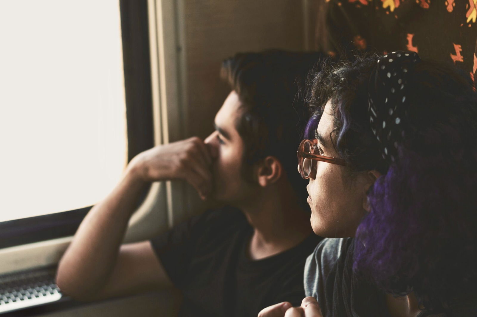 Friends looking out a window